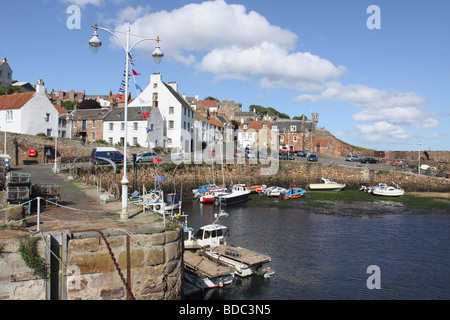 view of Crail harbour wall and village East Neuk Fife Scotland  August 2009 Stock Photo