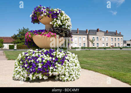 Multicoloured Begonias in round planter - Martizay, Indre, France. Stock Photo