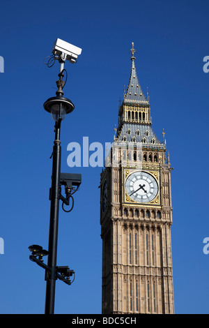 Big Ben and CCTV surveillance camera. The Houses of Parliament, Westminster London. Security cameras cover all of the city. Stock Photo