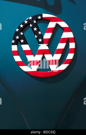 Volkswagen microbus with VW logo painted with stars and stripes parked in Haleiwa Oahu Hawaii Stock Photo