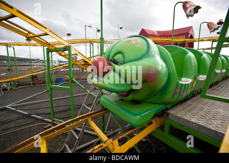 A green caterpillar roller coaster ride at Helensburgh, Scotland. Stock Photo