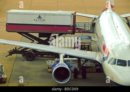 British Airways plane being loaded by Alpha Flight Services at Gatwick Airport, London, England Stock Photo