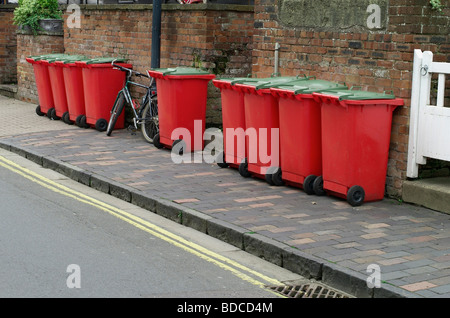 a line of full refuse bins waiting for collection Stock Photo - Alamy