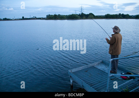 Fisherman fly fishing at Walthamstow fisheries, Walthamstow London England. Stock Photo