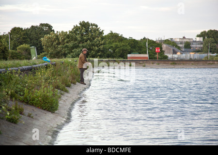 Fisherman fly fishing at Walthamstow fisheries, Walthamstow London England. Stock Photo