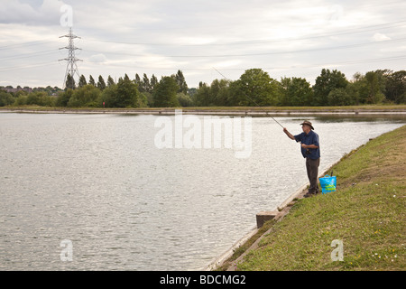 Fisherman fly fishing at Walthamstow fisheries, Walthamstow London England. Stock Photo