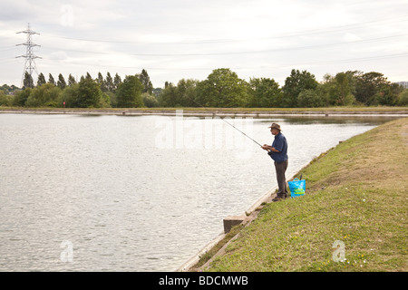 Fisherman fly fishing at Walthamstow fisheries, Walthamstow London England. Stock Photo