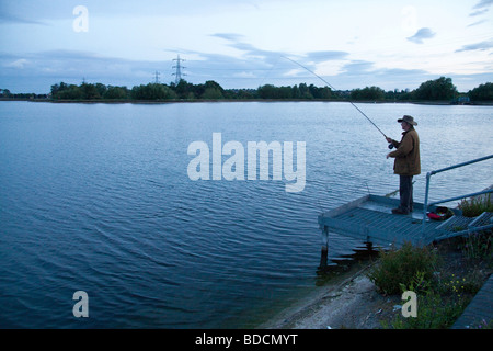 Fisherman fly fishing at Walthamstow fisheries, Walthamstow London England. Stock Photo