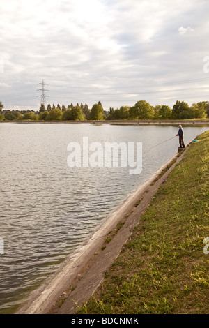 Fisherman fly fishing at Walthamstow fisheries, Walthamstow London England. Stock Photo