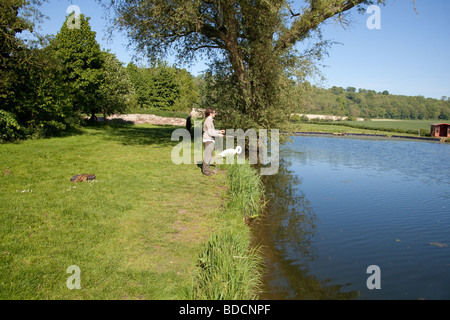 Fly Fisherman at Meon Springs Trout Fishery, Hampshire , England. Stock Photo