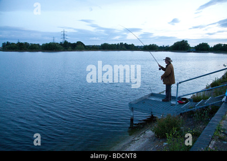 Fisherman fly fishing at Walthamstow fisheries, Walthamstow London England. Stock Photo