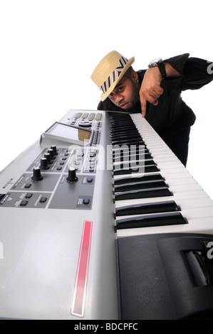 African American musician with electronic keyboard isolated over white Stock Photo