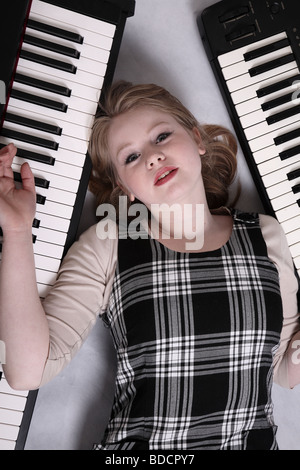 Cute blonde teenage girl musician of seventeen. Youth social issue series Stock Photo