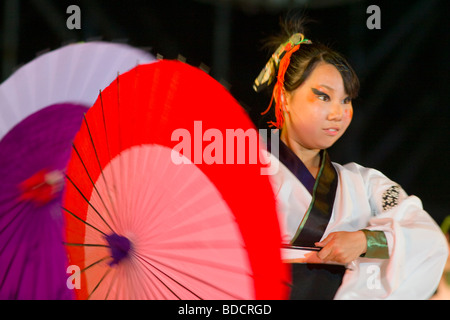 A female perfomer on stage at Odori Park during the Yosakoi Festival in Sapporo, Hokkaido, Japan Stock Photo