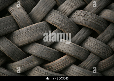 Stack of used car tires outside a speed shop - for use as a background Stock Photo