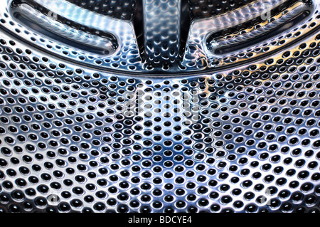 Steel drum inside a washing machine Stock Photo