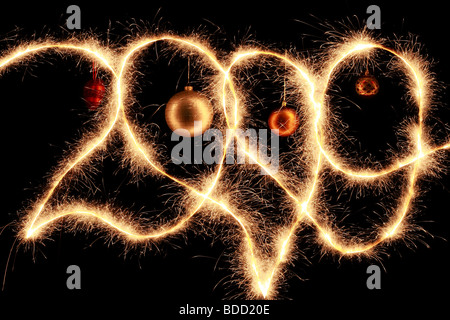 2009 written in sparkling letters on a black background with red heart between Stock Photo