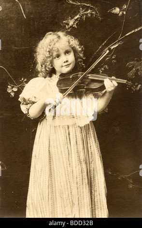 Little Girl Violinist Playing Violin Stock Photo