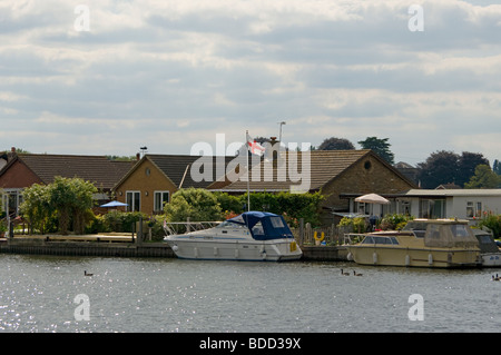 Riverside Property and Moored Boats On Desborough Island The River Thames Walton Surrey Stock Photo