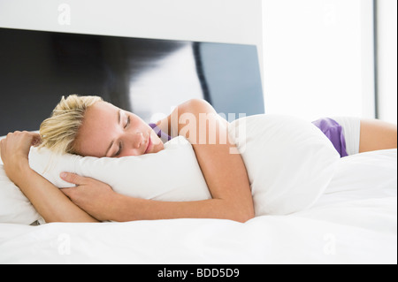 Woman sleeping on the bed Stock Photo