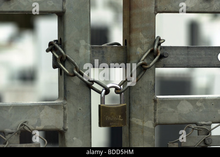 Padlock and chain on a gate Stock Photo