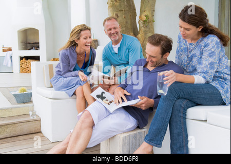 Four friends having fun at home Stock Photo