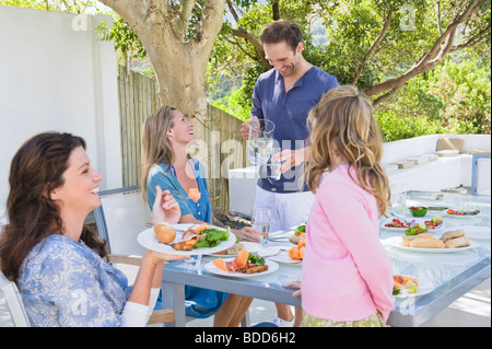 Family having breakfast at the dining table Stock Photo