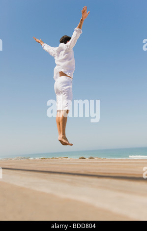 Man jumping on the beach Stock Photo
