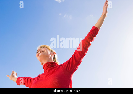 Woman stretching her arms and smiling Stock Photo