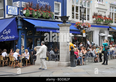 Cafe Creperie pavement cafe bars in an area of West End of London adjacent to St Christophers Place just off Oxford Street Stock Photo