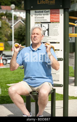 a 72 year old man doing low impact outdoor exercises, keeping fit and mobile Stock Photo
