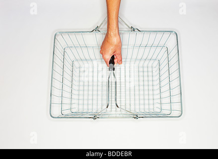 women holding a wire shopping basket Stock Photo