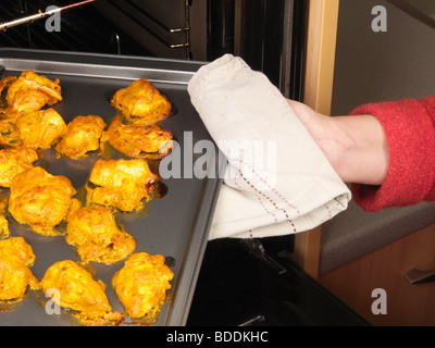 Shot 5 (Removing Chicken from Oven) Stock Photo