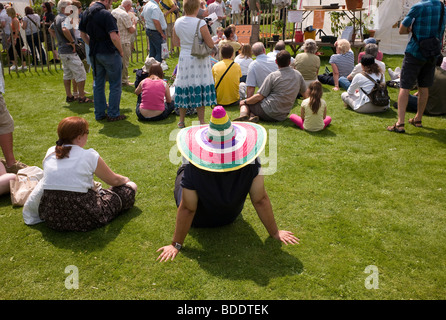 Man wearing sombrero bought at Chilli festival Stock Photo