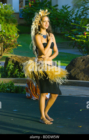 Young Hawaiian woman performing a Tahitian dance at Poipu Shopping Village Kauai HI Stock Photo