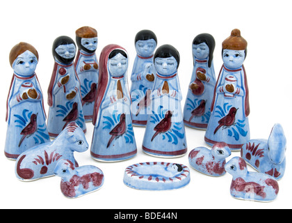 A glass Nativity scene displayed against a white background. Stock Photo