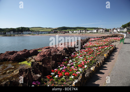 Looking across a floral display on the East Side of the town of Millport in the Island of Great Cumbrae Ayrshire Scotland UK Stock Photo