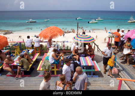 People celebrating during a party in a bar on the beach on Great Abaco island Bahamas Stock Photo