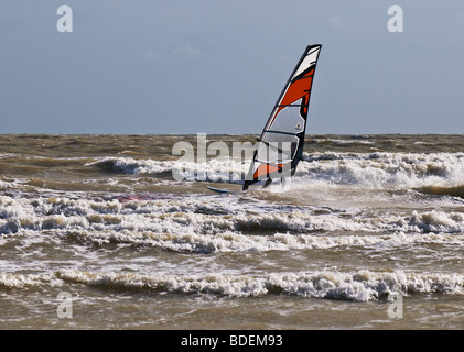 A windsurfer in the sea off Camber Sands in Sussex.  Photo by Gordon Scammell Stock Photo