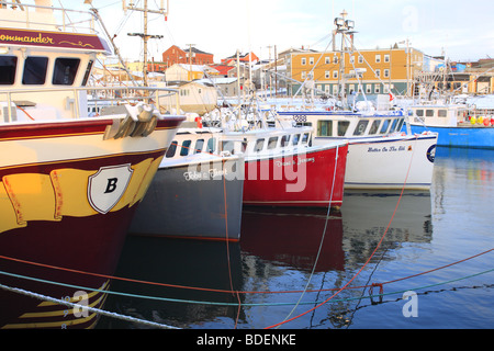 Ships and Fishing Boats tied up at Yarmouth, Nova Scotia, Canada in the winter time Stock Photo