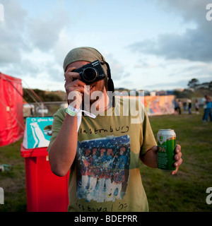 Young man using a Canon compact digital camera at The Square Festival, Borth, July 2009. Wales UK Stock Photo