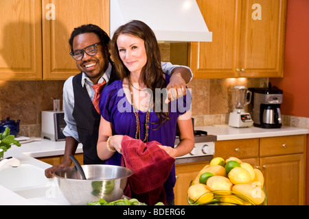 Interracial couple in kitchen Stock Photo
