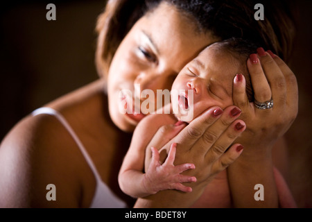 African-American mother holding newborn baby in hands Stock Photo