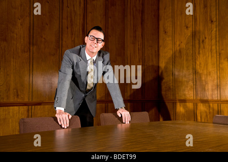 Vintage portrait of mid adult businessman in boardroom Stock Photo
