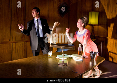 Vintage portrait of businessman and secretary in office Stock Photo