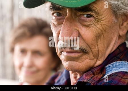 Close-up of senior man wearing green cap Stock Photo