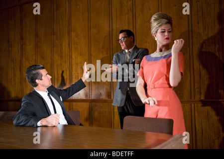 Vintage portrait of two businessmen and blonde secretary Stock Photo