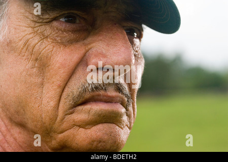 Close-up of pensive senior man wearing cap Stock Photo