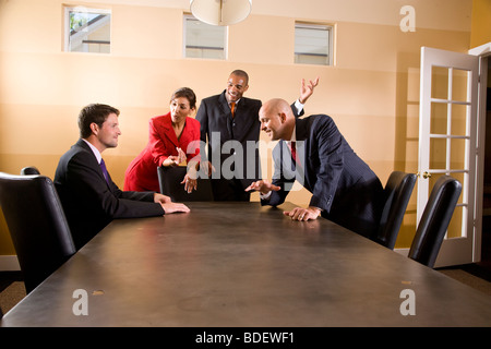 Multi-ethnic business managers meeting in boardroom Stock Photo
