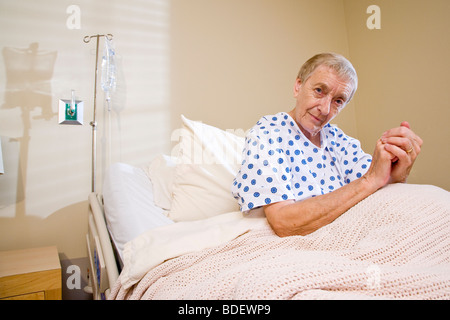 Elderly woman in hospital bed Stock Photo